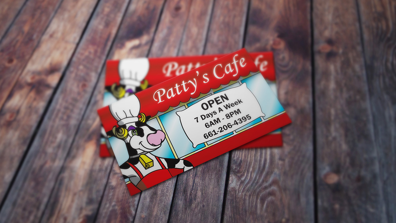 Patty's Cafe cow print logo on business card design.